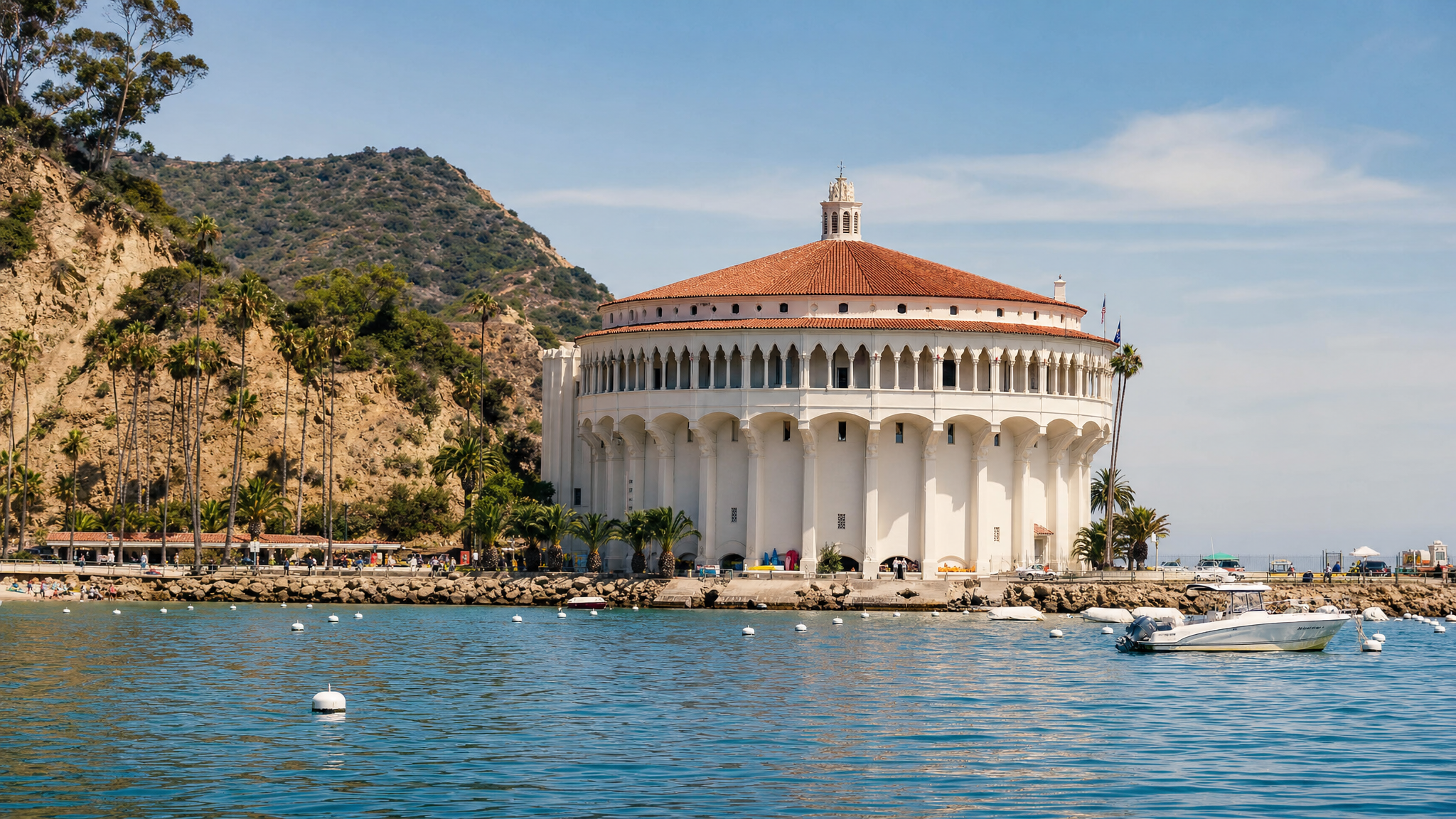 The Catalina Casino exterior above the promenade with warm light and harbor atmosphere.