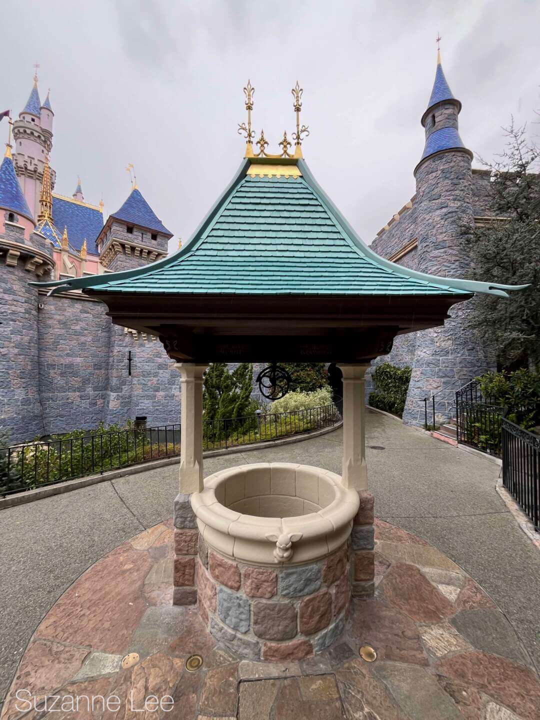 Snow White's Wishing Well beside Sleeping Beauty Castle in Disneyland.